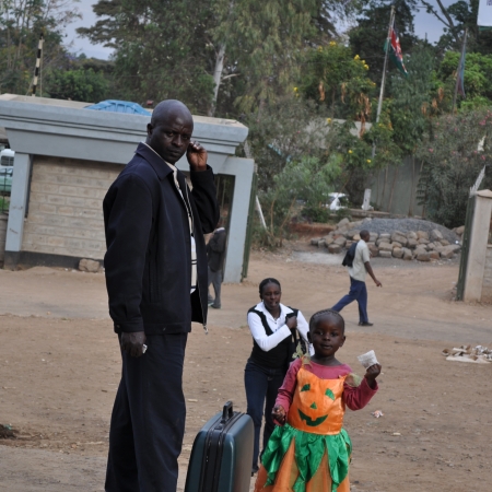 A child in a pumpkin dress in Kibera slum