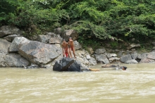 Boys swimming in the river, Panama