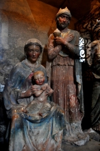 Mary and Joseph holding Jesus (statues)