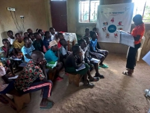 Children attentively listening to the peace trainer